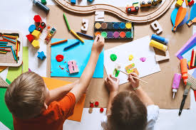 Teacher helping children